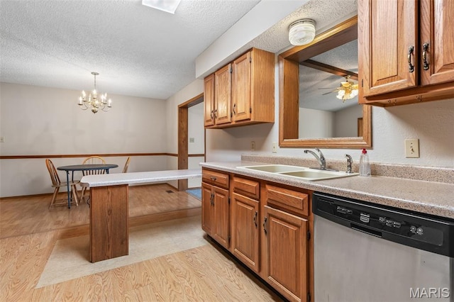 423 Rice Rd, Bonne Terre, MO 63628 - kitchen featuring stainless steel dishwasher, a sink, light wood-style flooring, a textured ceiling, and ceiling fan
