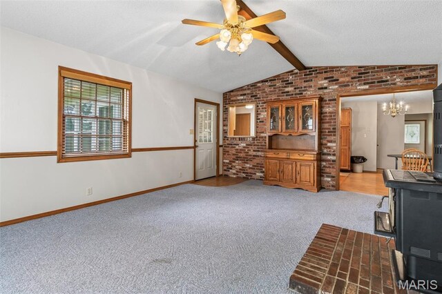 423 Rice Rd, Bonne Terre, MO 63628 - unfurnished living room with brick wall, a chandelier, light carpet, a ceiling fan, and baseboards