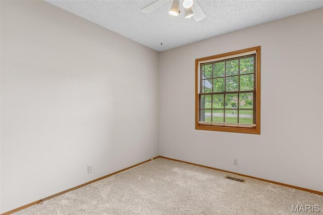 423 Rice Rd, Bonne Terre, MO 63628 - unfurnished room featuring carpet floors, baseboards, ceiling fan, and a textured ceiling