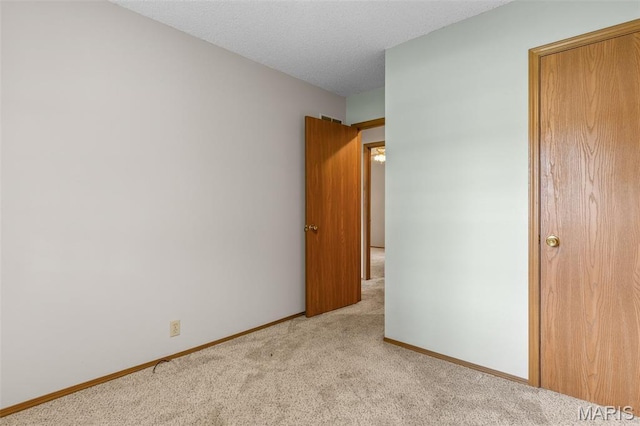423 Rice Rd, Bonne Terre, MO 63628 - unfurnished bedroom with carpet flooring, baseboards, and a textured ceiling