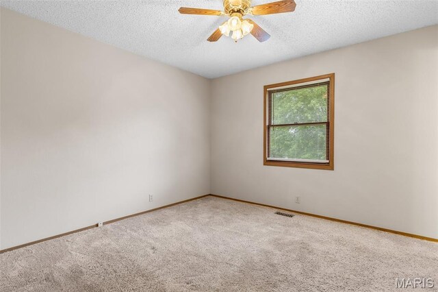 423 Rice Rd, Bonne Terre, MO 63628 - carpeted spare room with ceiling fan, baseboards, and a textured ceiling