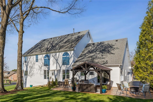 1155 Whitmoor Dr, Weldon Spring, MO 63304 - rear view of house with a gazebo, a patio area, a lawn, an outdoor living space with a fire pit, and a shingled roof