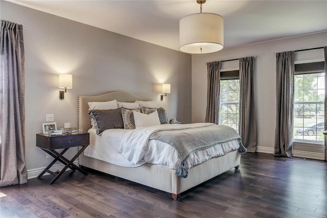 1155 Whitmoor Dr, Weldon Spring, MO 63304 - bedroom featuring dark wood-style floors, multiple windows, and baseboards