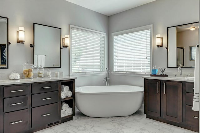 1155 Whitmoor Dr, Weldon Spring, MO 63304 - full bath with marble finish floors, vanity, and a freestanding tub