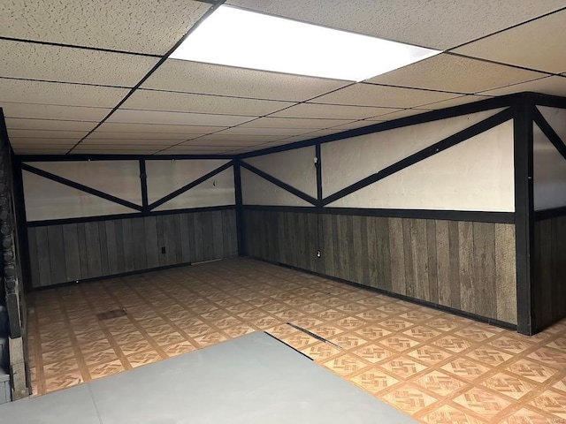 5220 Delcastle Dr, Florissant, MO 63034 - additional living space with light floors and wood walls