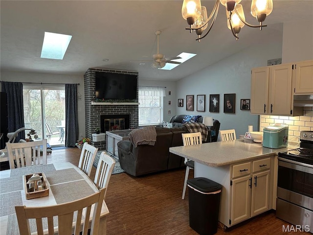 70 Innsbruck Ln, Shiloh, IL 62221 - kitchen featuring stainless steel electric range oven, a skylight, vaulted ceiling, light countertops, and open floor plan