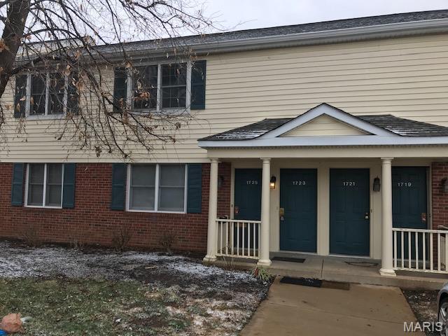 1723 Canary Cv, Brentwood, MO 63144 - view of property featuring brick siding and covered porch