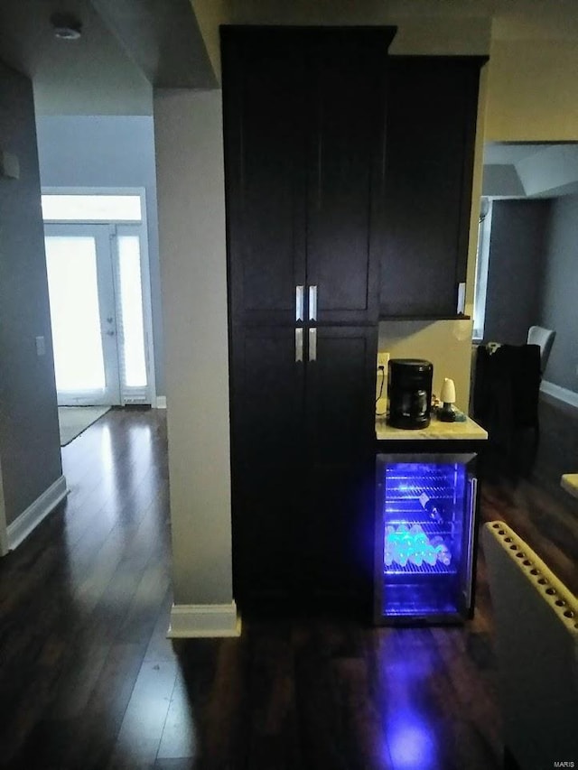 5835 Degiverville Ave, Saint Louis, MO 63112 - bar featuring dark wood-style flooring and baseboards