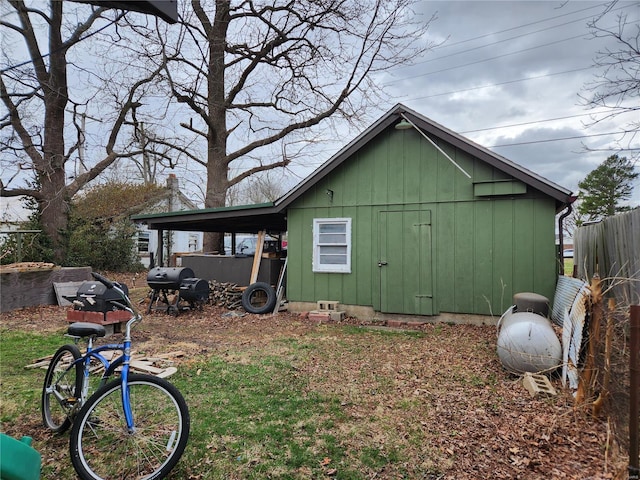 view of side of home featuring fence and board and batten siding