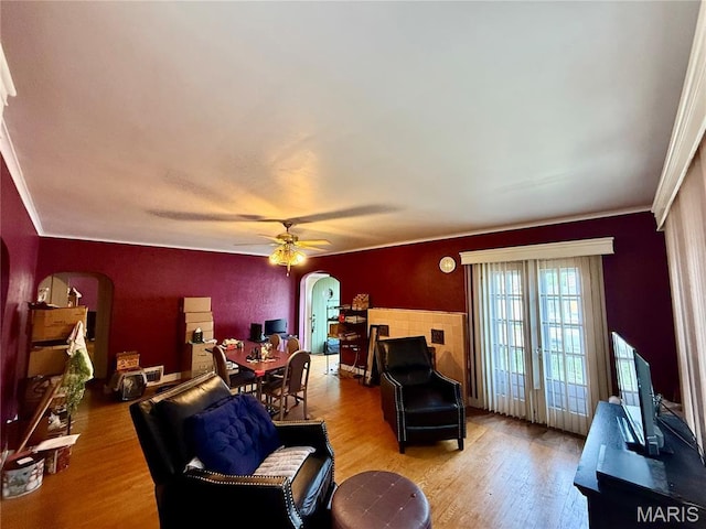 210 Linn St, Belle, MO 65013 - living room with arched walkways, wood finished floors, ceiling fan, and crown molding