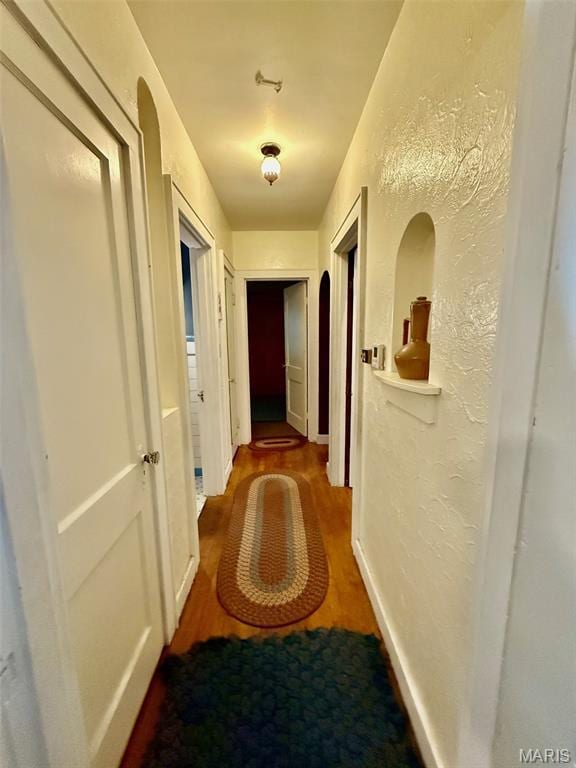 210 Linn St, Belle, MO 65013 - corridor featuring wood finished floors and a textured wall