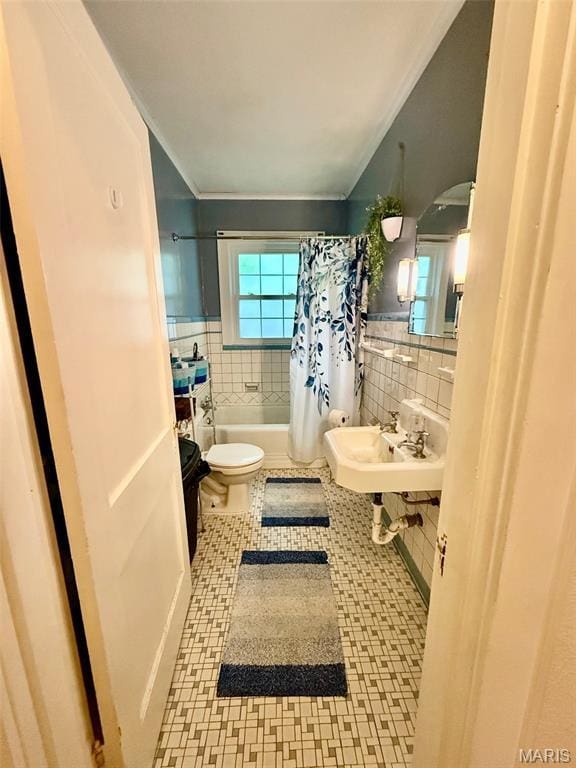 210 Linn St, Belle, MO 65013 - full bathroom featuring tile walls, shower / bathtub combination with curtain, wainscoting, ornamental molding, and tile patterned floors