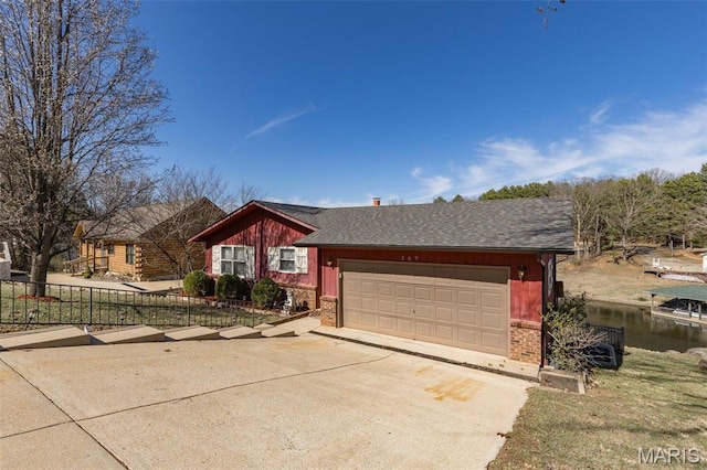 207 Normandie Dr, Bonne Terre, MO 63628 - ranch-style house with concrete driveway, a garage, brick siding, and roof with shingles