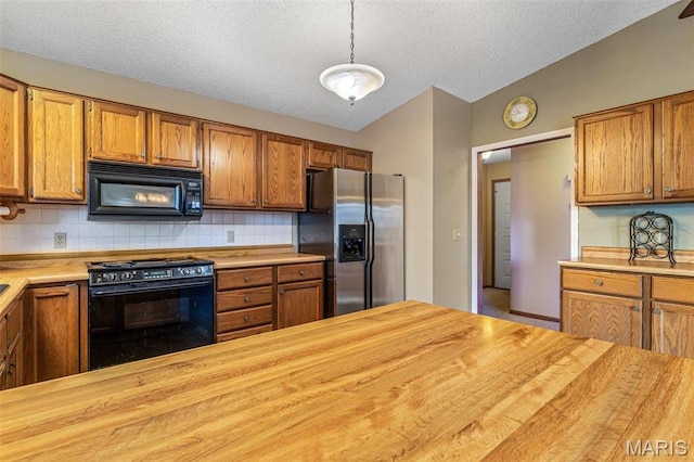 207 Normandie Dr, Bonne Terre, MO 63628 - kitchen with black appliances, wooden counters, a textured ceiling, backsplash, and brown cabinetry