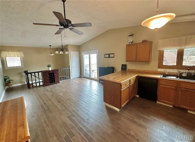 207 Normandie Dr, Bonne Terre, MO 63628 - kitchen featuring dishwasher, a textured ceiling, a peninsula, light countertops, and dark wood-style floors