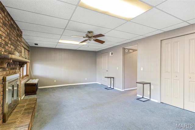 207 Normandie Dr, Bonne Terre, MO 63628 - unfurnished living room with carpet, a paneled ceiling, a brick fireplace, and ceiling fan