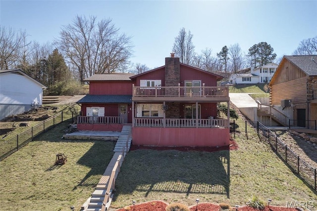 207 Normandie Dr, Bonne Terre, MO 63628 - back of property featuring a chimney, stairs, a wooden deck, and a fenced backyard