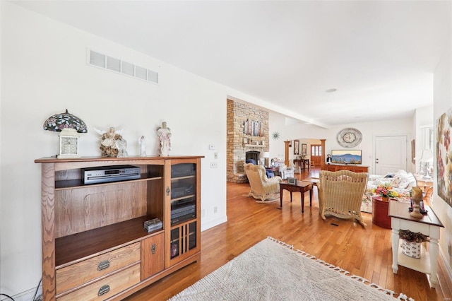 900 Deer Circle Dr, Carlyle, IL 62231 - living room with light wood-style flooring and a fireplace