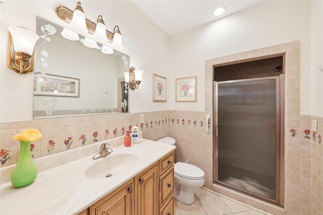 900 Deer Circle Dr, Carlyle, IL 62231 - full bath with tile walls, a shower stall, toilet, vanity, and tile patterned floors