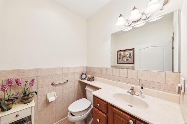 900 Deer Circle Dr, Carlyle, IL 62231 - half bathroom featuring tile walls, vanity, toilet, a wainscoted wall, and a chandelier