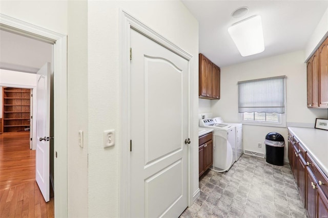 900 Deer Circle Dr, Carlyle, IL 62231 - clothes washing area featuring cabinet space, washing machine and dryer, and baseboards