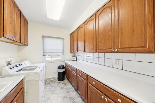 900 Deer Circle Dr, Carlyle, IL 62231 - laundry area with cabinet space, washing machine and dryer, and baseboards