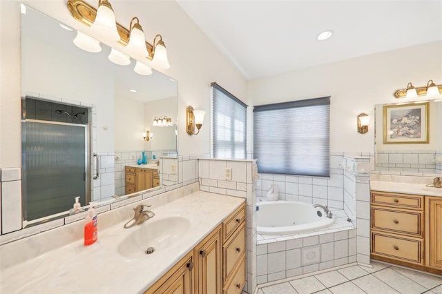 900 Deer Circle Dr, Carlyle, IL 62231 - bathroom featuring tile patterned floors, a stall shower, tile walls, a tub with jets, and two vanities