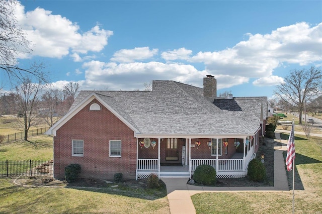 900 Deer Circle Dr, Carlyle, IL 62231 - view of front of property featuring a porch, brick siding, a chimney, and roof with shingles