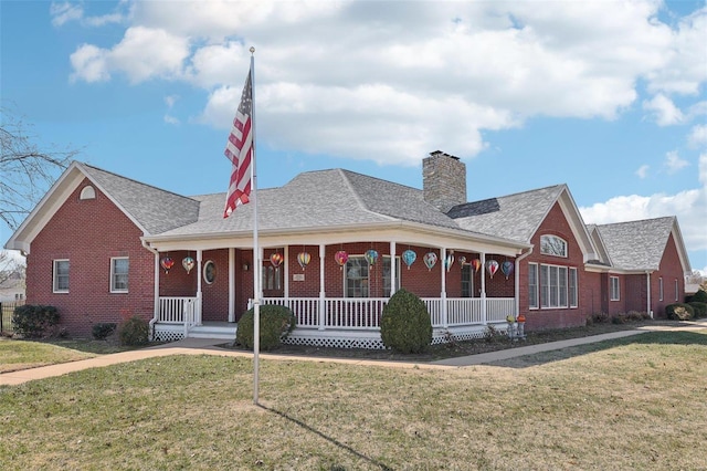 900 Deer Circle Dr, Carlyle, IL 62231 - view of front facade featuring covered porch, brick siding, and a front yard