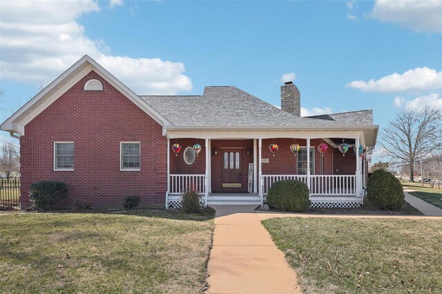 900 Deer Circle Dr, Carlyle, IL 62231 - view of front of property featuring brick siding, a chimney, covered porch, and roof with shingles