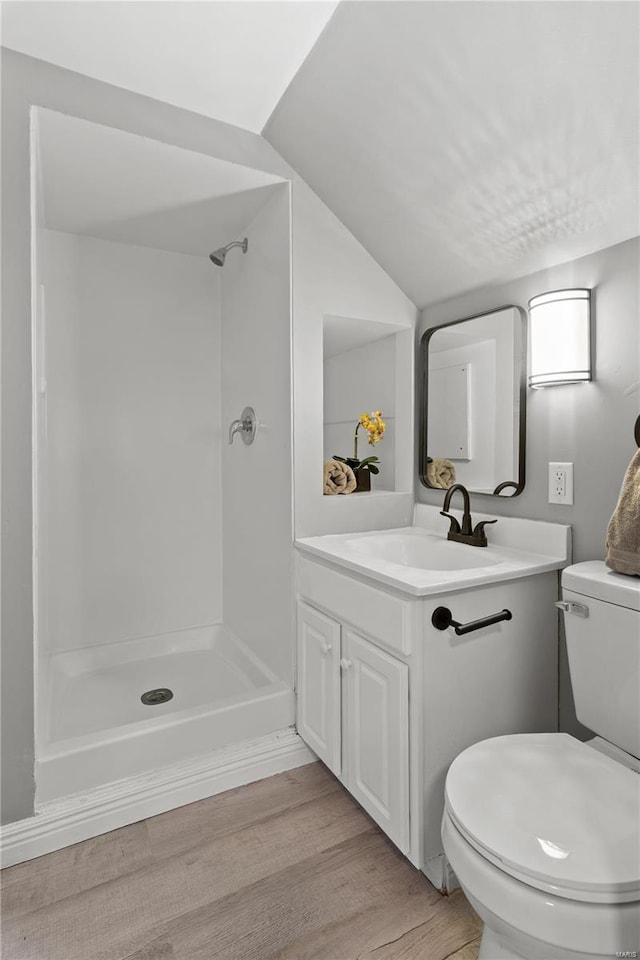 554 S Clay Ave, Saint Louis, MO 63122 - bathroom featuring a shower, toilet, vanity, wood finished floors, and vaulted ceiling