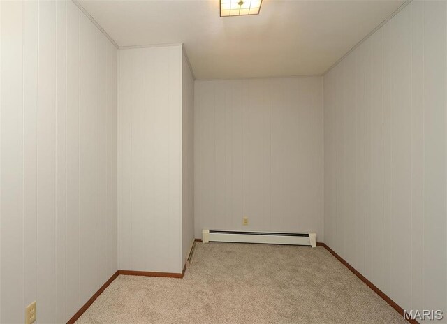 8032 Blue Mound Dr, Saint Rose, IL 62230 - carpeted empty room featuring baseboard heating, baseboards, and wooden walls