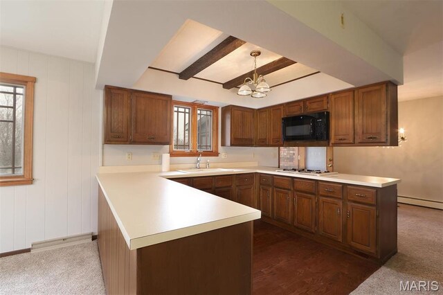 8032 Blue Mound Dr, Saint Rose, IL 62230 - kitchen with black microwave, a sink, a chandelier, light countertops, and a peninsula