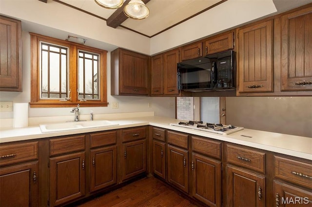 8032 Blue Mound Dr, Saint Rose, IL 62230 - kitchen featuring black microwave, a sink, white gas stovetop, light countertops, and dark wood-type flooring
