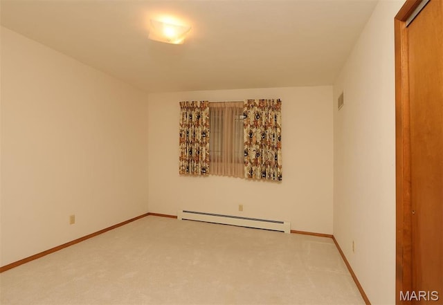 8032 Blue Mound Dr, Saint Rose, IL 62230 - empty room with a baseboard heating unit, light colored carpet, and baseboards