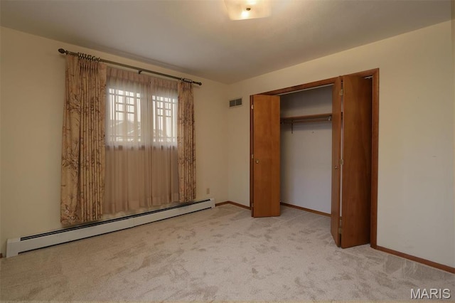 8032 Blue Mound Dr, Saint Rose, IL 62230 - unfurnished bedroom featuring a baseboard radiator, carpet flooring, baseboards, and a closet