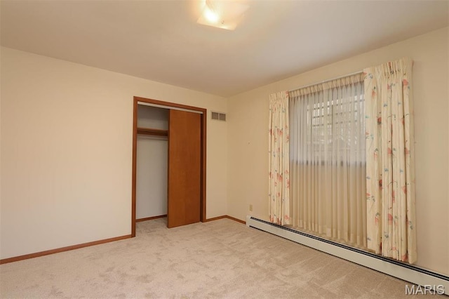 8032 Blue Mound Dr, Saint Rose, IL 62230 - unfurnished bedroom featuring a baseboard radiator, carpet, baseboards, and a closet