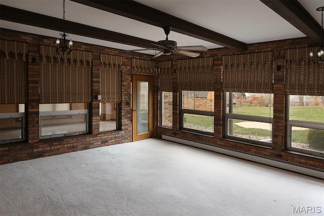 8032 Blue Mound Dr, Saint Rose, IL 62230 - unfurnished living room with a chandelier, carpet flooring, a baseboard radiator, beamed ceiling, and brick wall