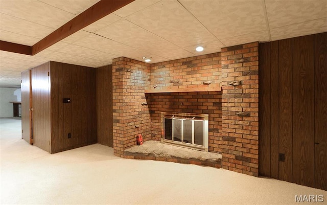 8032 Blue Mound Dr, Saint Rose, IL 62230 - unfurnished living room featuring wood walls, carpet flooring, and a fireplace