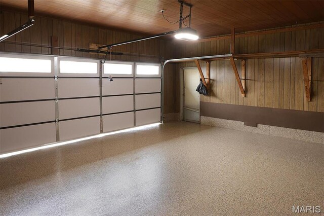 8032 Blue Mound Dr, Saint Rose, IL 62230 - garage featuring wood walls, wooden ceiling, and a garage door opener