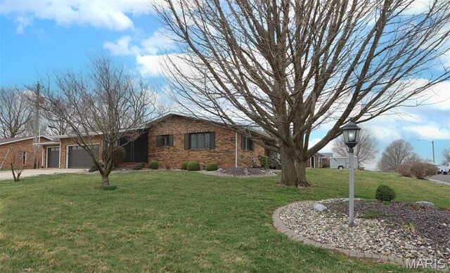 8032 Blue Mound Dr, Saint Rose, IL 62230 - view of front of home with an attached garage, a front yard, driveway, and brick siding