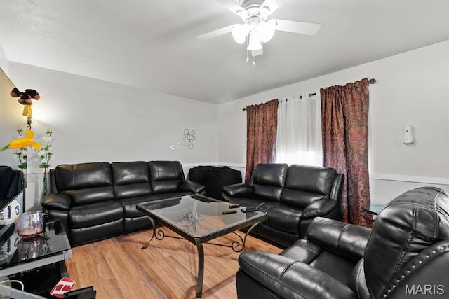 2755 Patterson Rd, Florissant, MO 63031 - living area with ceiling fan and wood finished floors