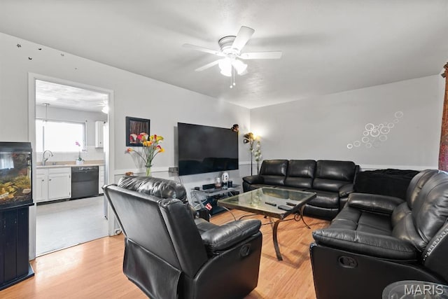 2755 Patterson Rd, Florissant, MO 63031 - living room featuring a ceiling fan and light wood-style flooring