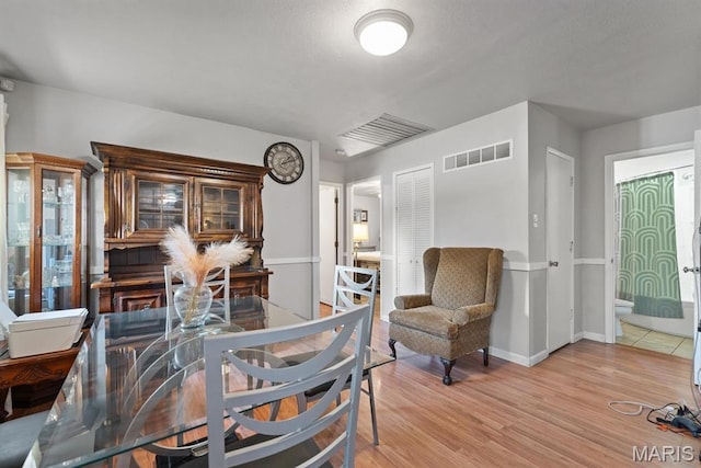 2755 Patterson Rd, Florissant, MO 63031 - dining room with light wood finished floors and baseboards