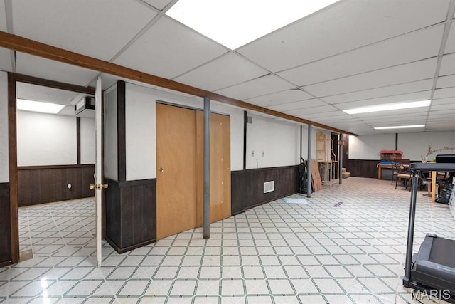 2755 Patterson Rd, Florissant, MO 63031 - finished below grade area with wainscoting, wood walls, and a paneled ceiling