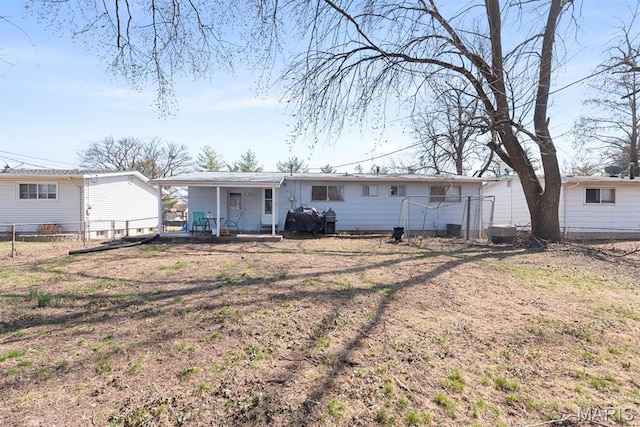 2755 Patterson Rd, Florissant, MO 63031 - rear view of property featuring covered porch