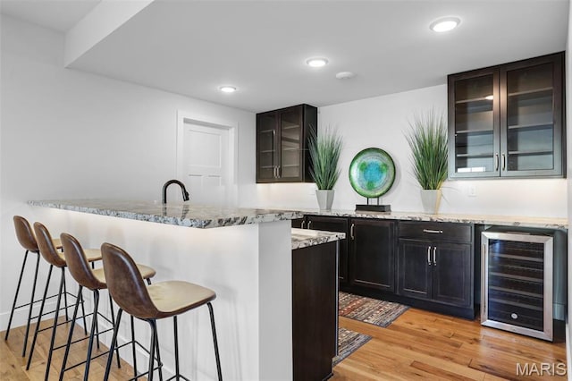 1520 Oglesby Dr, Edwardsville, IL 62025 - indoor wet bar with beverage cooler, light wood-style flooring, and recessed lighting