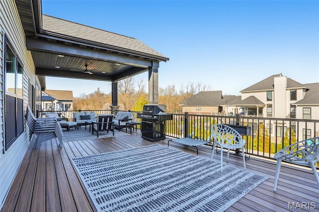 1520 Oglesby Dr, Edwardsville, IL 62025 - wooden deck with outdoor lounge area, grilling area, a ceiling fan, and a residential view