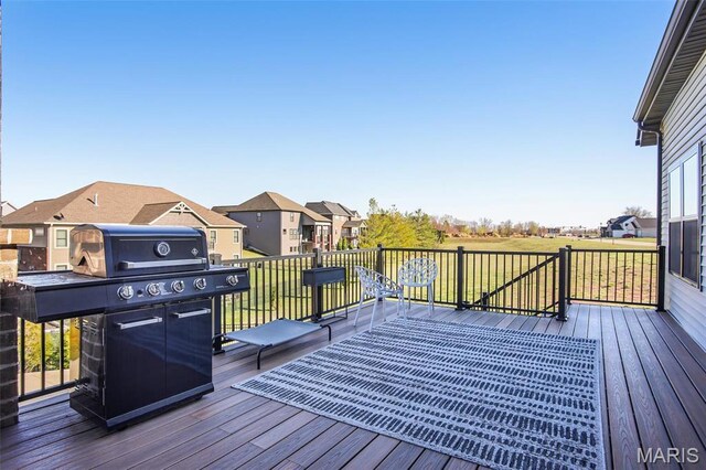 1520 Oglesby Dr, Edwardsville, IL 62025 - wooden terrace with a residential view, a grill, and a lawn