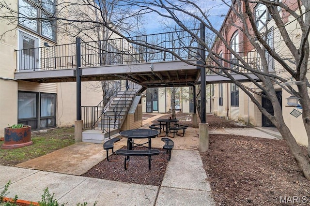 1523 S 10th St Unit 206, Saint Louis, MO 63104 - view of patio featuring a fire pit and stairs